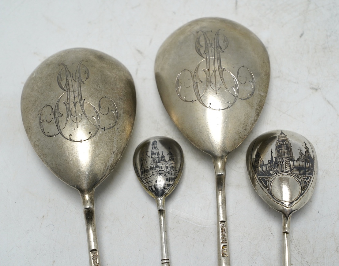 A pair of late 19th century Russian 84 zolotnik serving spoons, Moscow, 1896, 18.8cm, and two other smaller Russian 84 zolotnik and niello spoons. Condition - fair